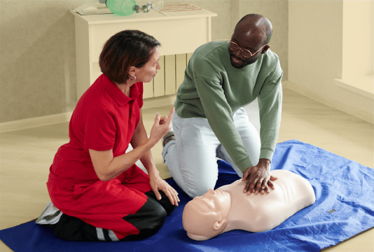 Safety and Health Week: Two employees are taking part in a first aid safety training course in their worlplace